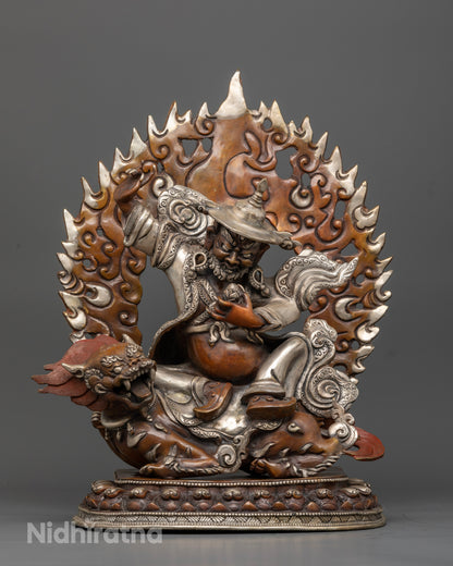 Dorje Lekpa statue seated on snow lion with oxidized copper and silver-plated finish