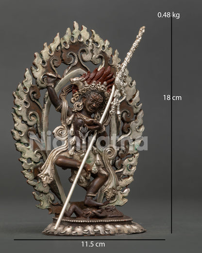 Dorje Phagmo dancing above subdued figure on lotus pedestal.