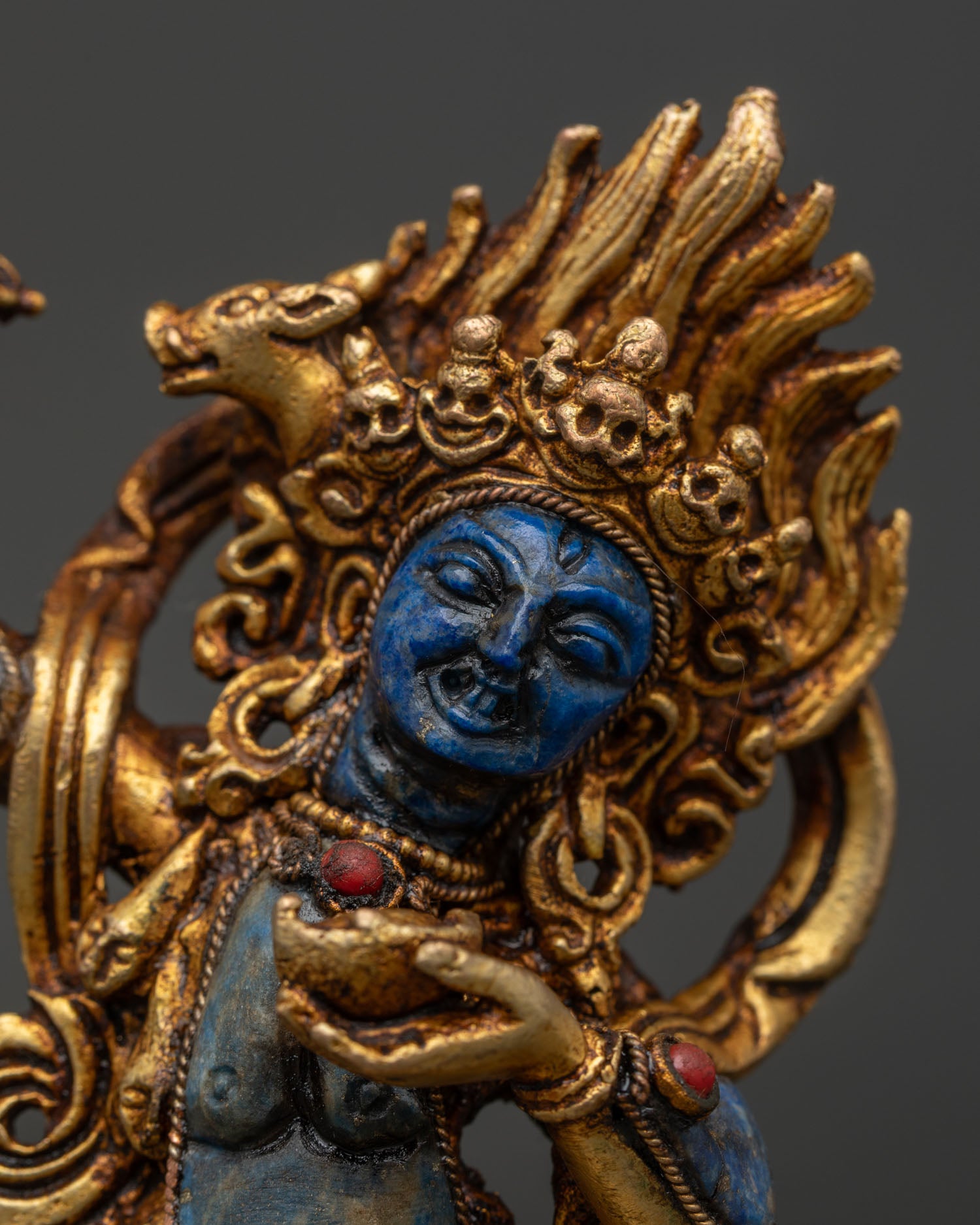 Dorje Phagmo Statue featuring lapis lazuli body, gold fire gilding, and Newari craftsmanship