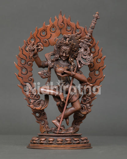 Dorje Phagmo Vajrayogini statue in dynamic dancing posture with flaming halo and lotus pedestal.