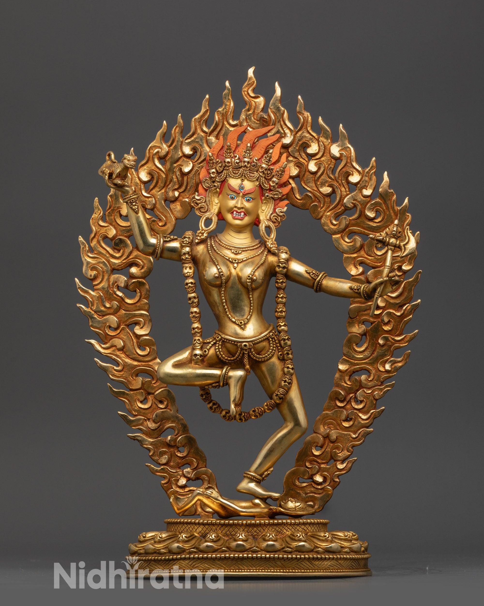 dorje phagmo statue front view with gold gilded face and fire gilded copper body
