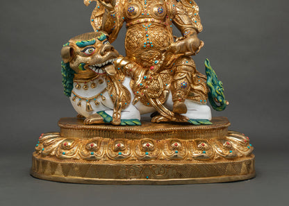 down close up of Namtoshe statue showing gold armor, mongoose and hand-inlaid turquoise and coral
