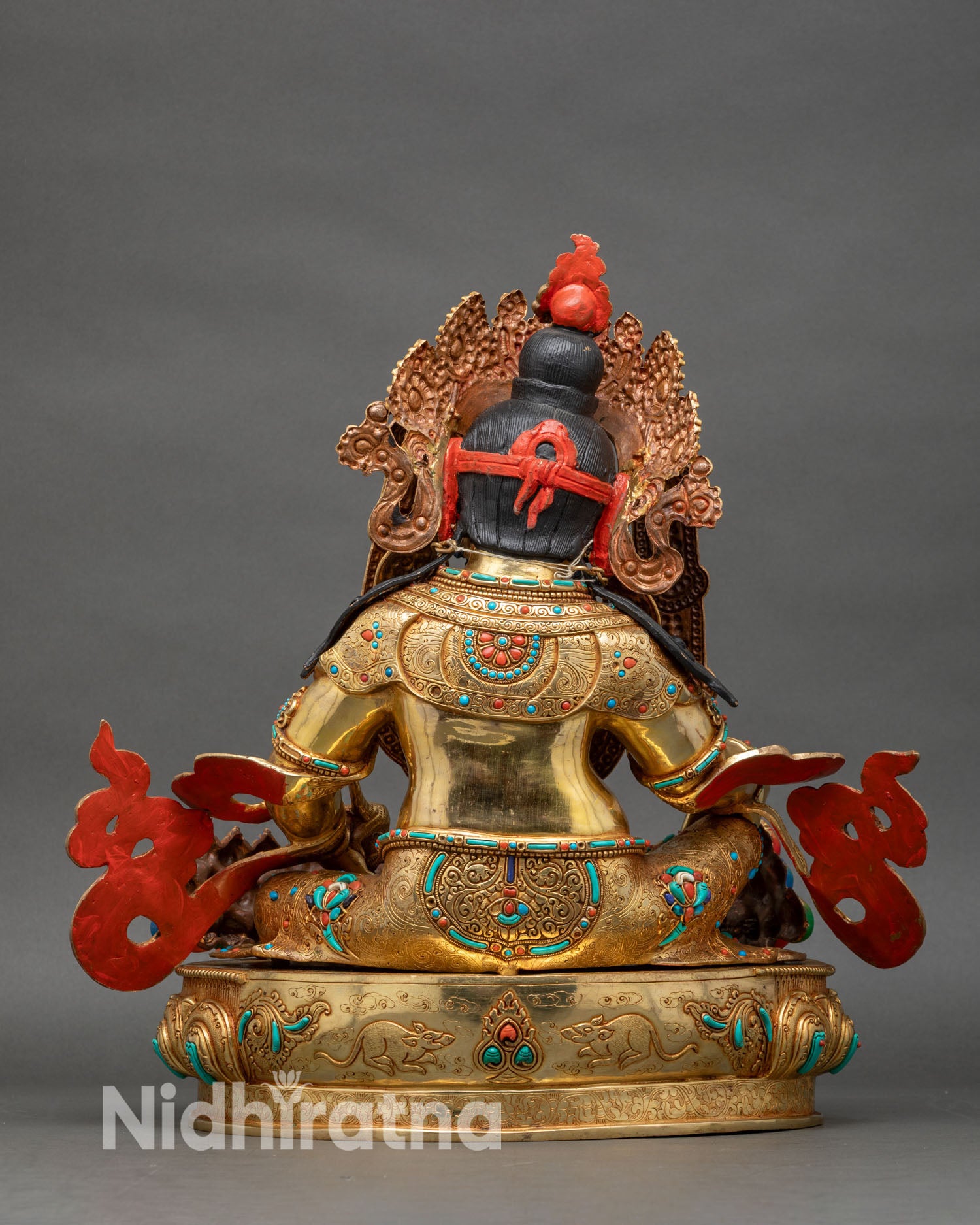 Dzambhala back view red coral topknot gold repoussé body turquoise inlay lotus base