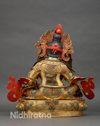 Dzambhala back view red coral topknot gold repoussé body turquoise inlay lotus base