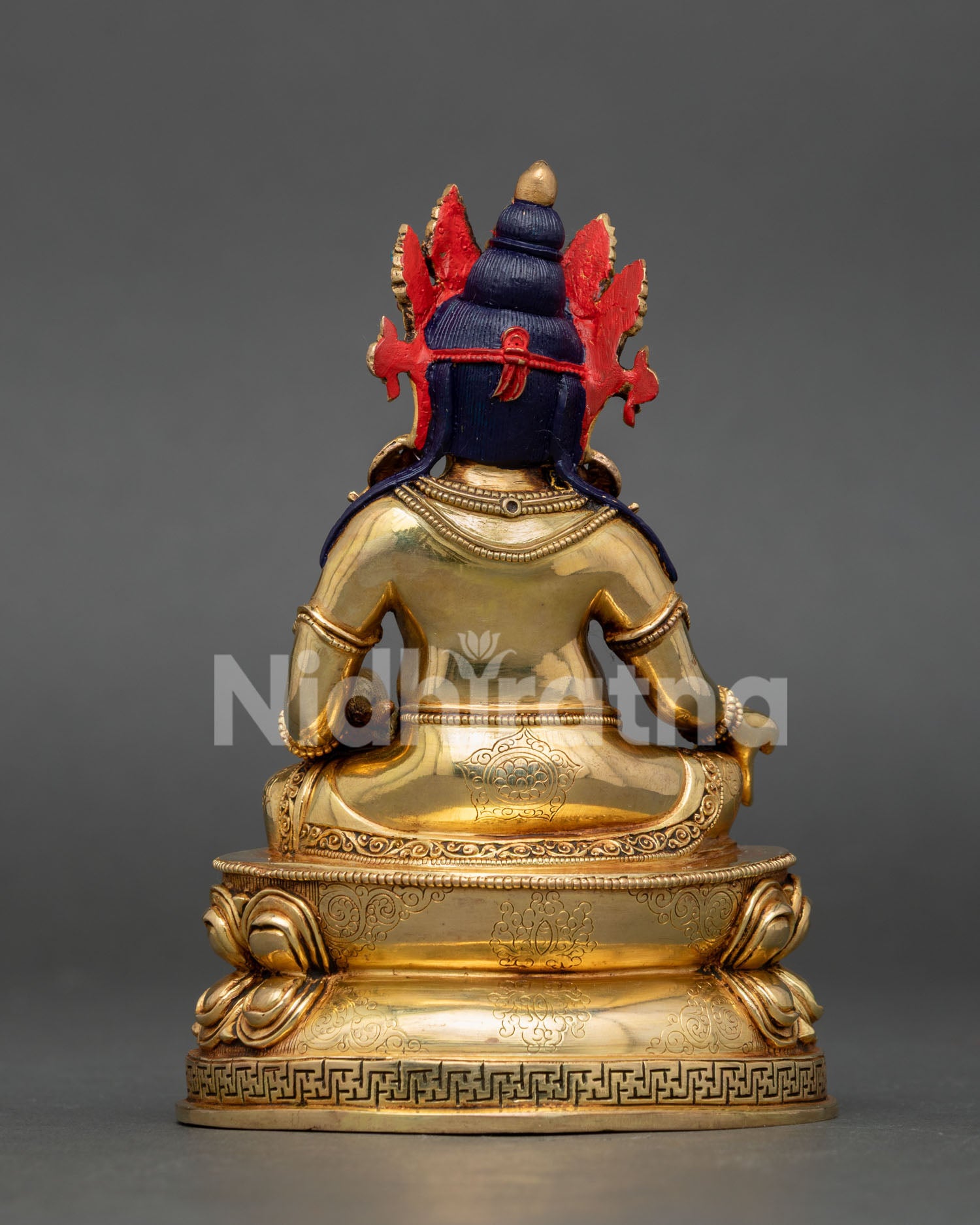 Dzambhala Buddhist sculpture featuring Newari craftsmanship, sacred jewelry, and wealth deity symbolism.