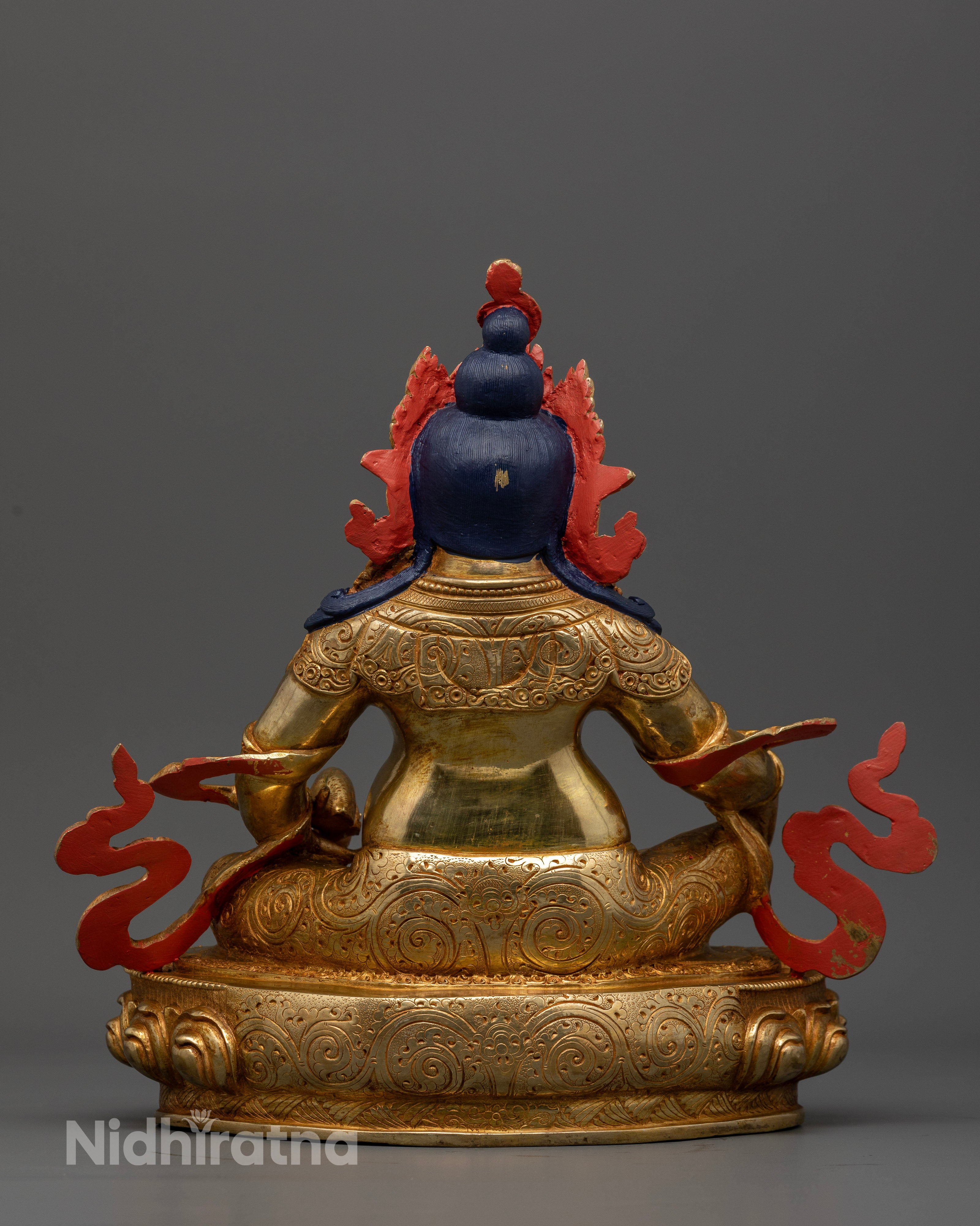Dzambhala Buddhist statue with hand carved floral royal garment and gold gilded details.