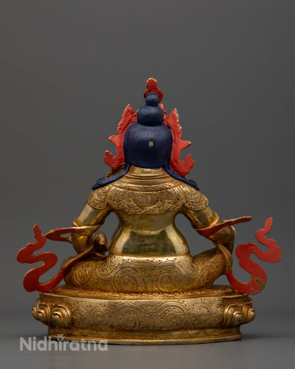 Dzambhala Buddhist statue with hand carved floral royal garment and gold gilded details.