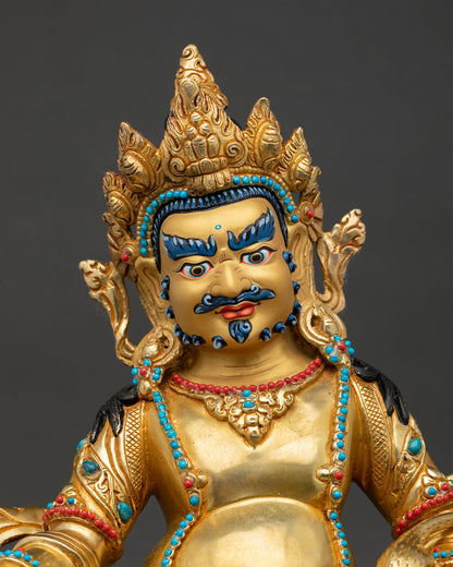 Dzambhala face showing gold painted features semi precious stones and detailed Himalayan craftsmanship