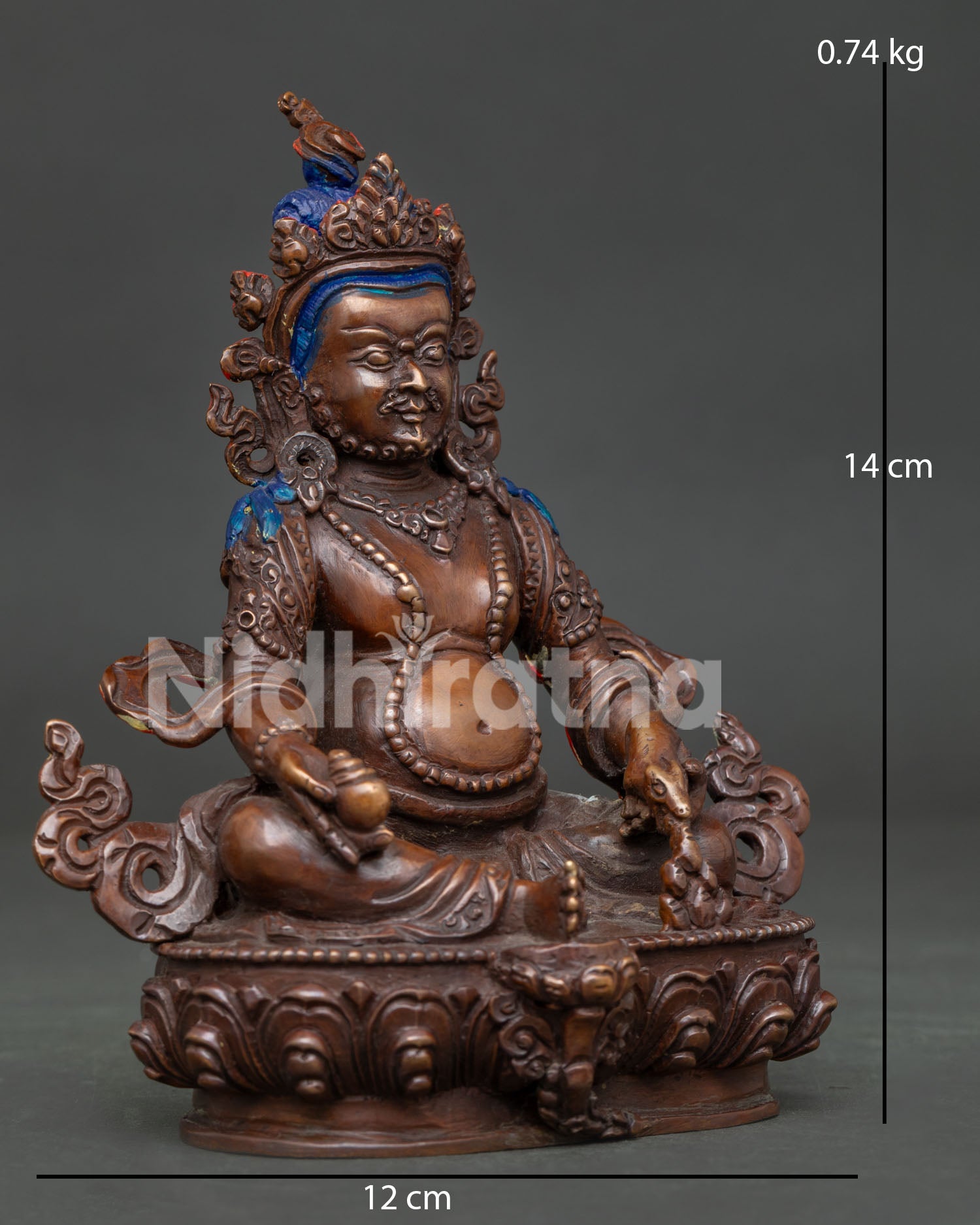 Dzambhala sculpture holding a jewel-spouting mongoose and wish-fulfilling jewel symbolizing abundance