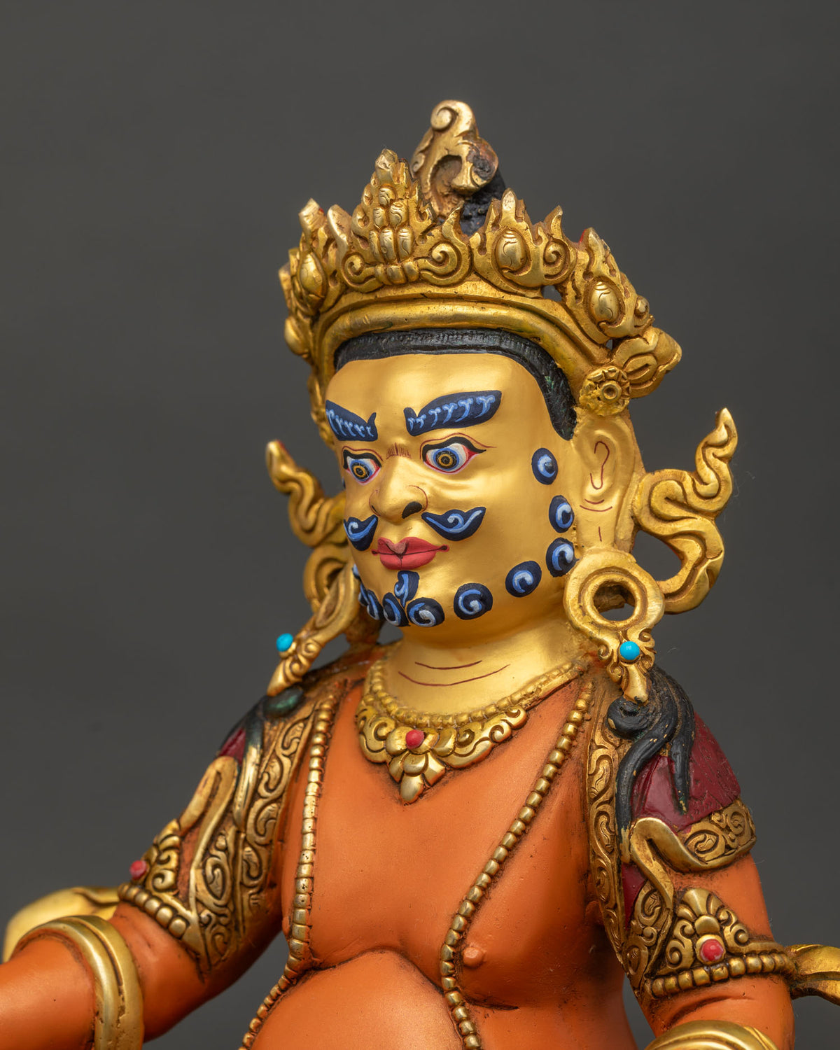 Dzambhala statue acrylic painted finish gold gilded details.
