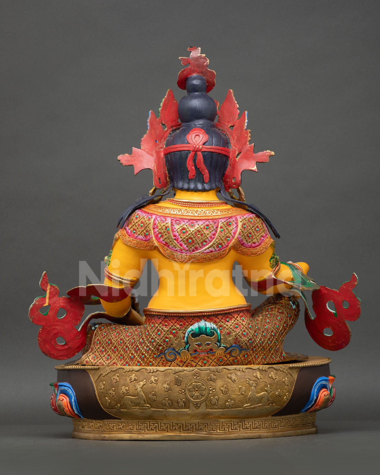 Dzambhala statue back showing lotus seat with Kirtimukha, Dharma Wheel and deer, Nepal handcrafted