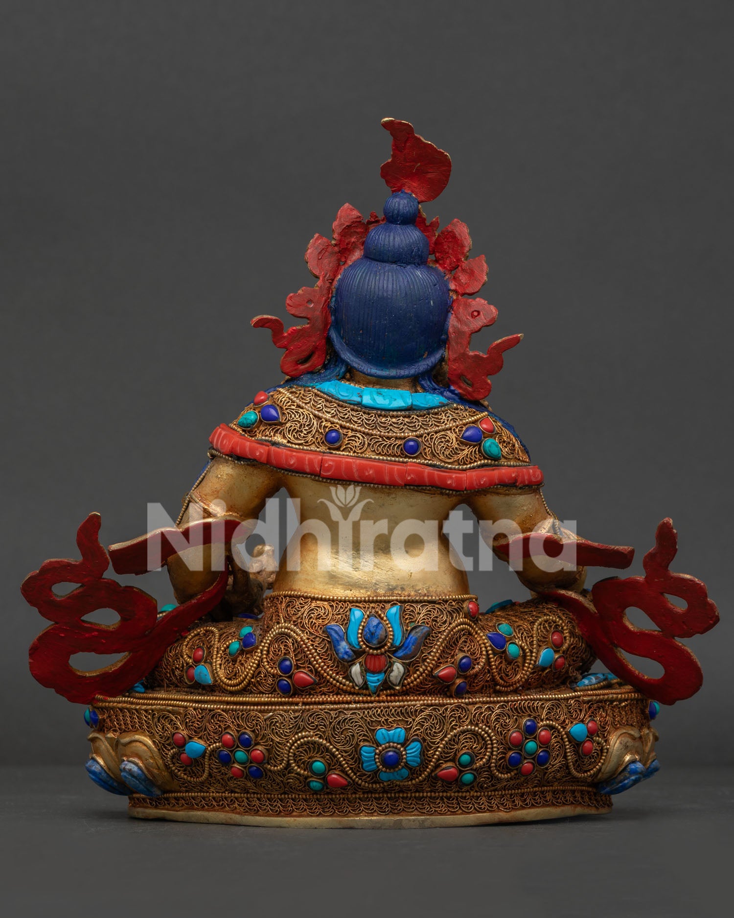 Dzambhala Statue back view featuring handcrafted lapis lazuli carving, filigree design and Newari artisan details