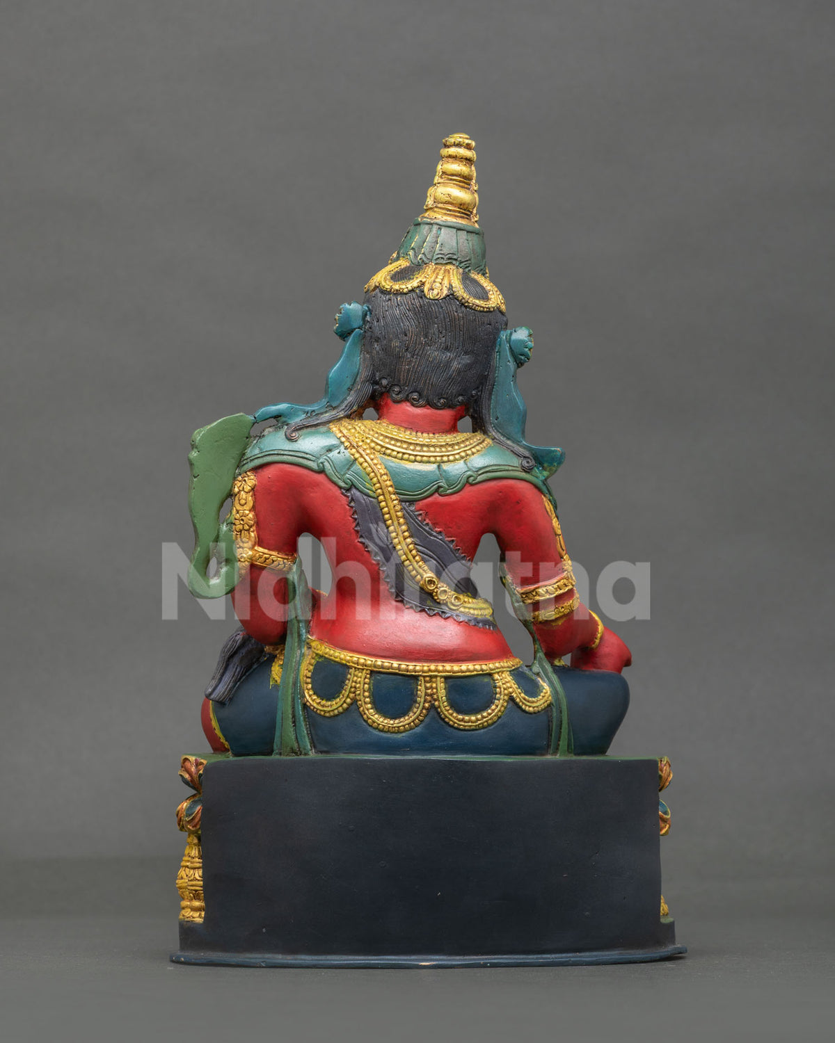 Dzambhala Statue back view intricate ornamentation acrylic painted copper.