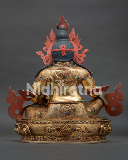 dzambhala statue back view lotus pedestal cintamani design mice motifs