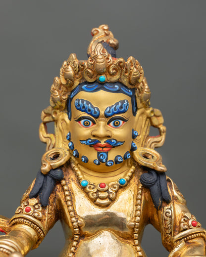 Dzambhala statue close up detail five jeweled crown mongoose citron fruit semi precious stones Buddhist prosperity god art