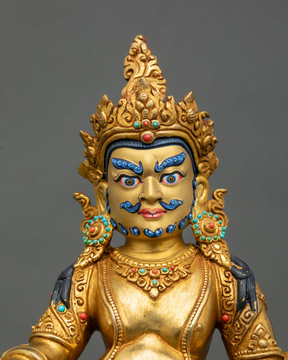 Dzambhala statue close up jeweled crown semi precious stones mongoose citron fruit Buddhist wealth god art