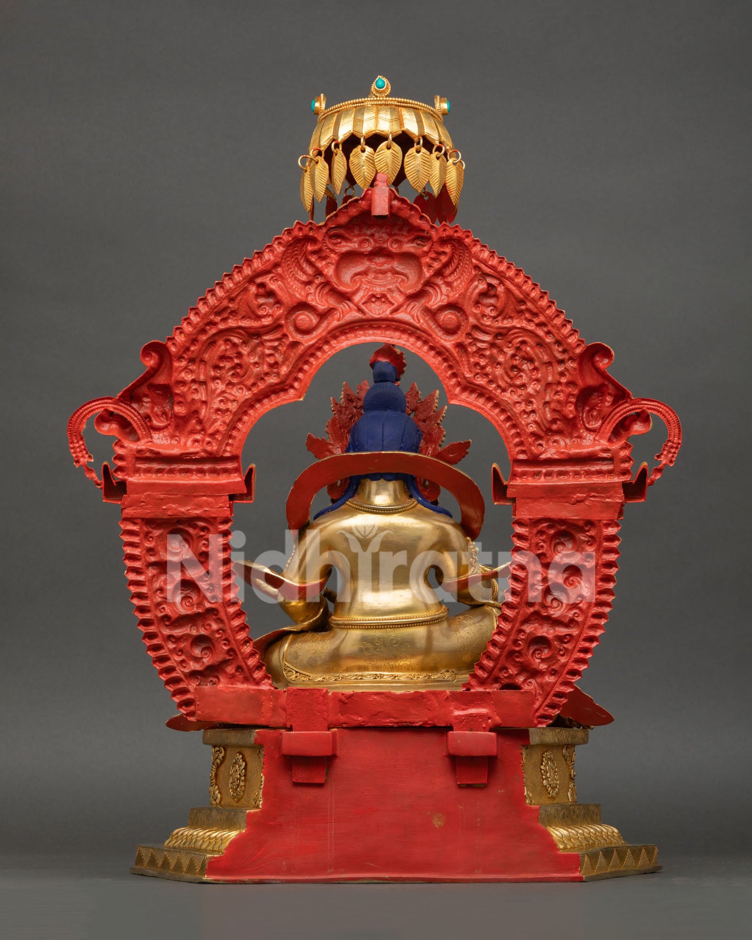 Dzambhala Statue from Nepal displaying 24K gold fire gilding, jeweled parasol, and traditional Newari artistry