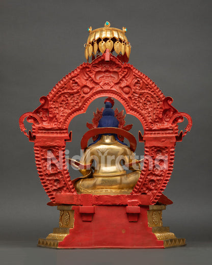Dzambhala Statue from Nepal displaying 24K gold fire gilding, jeweled parasol, and traditional Newari artistry