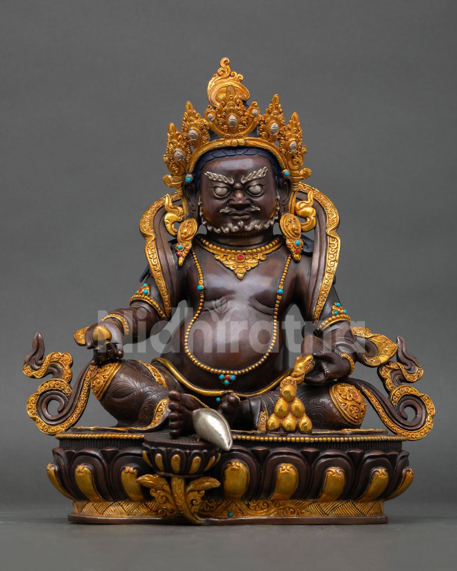 Dzambhala statue from Nepal handcrafted copper with gold gilded finish seated on lotus