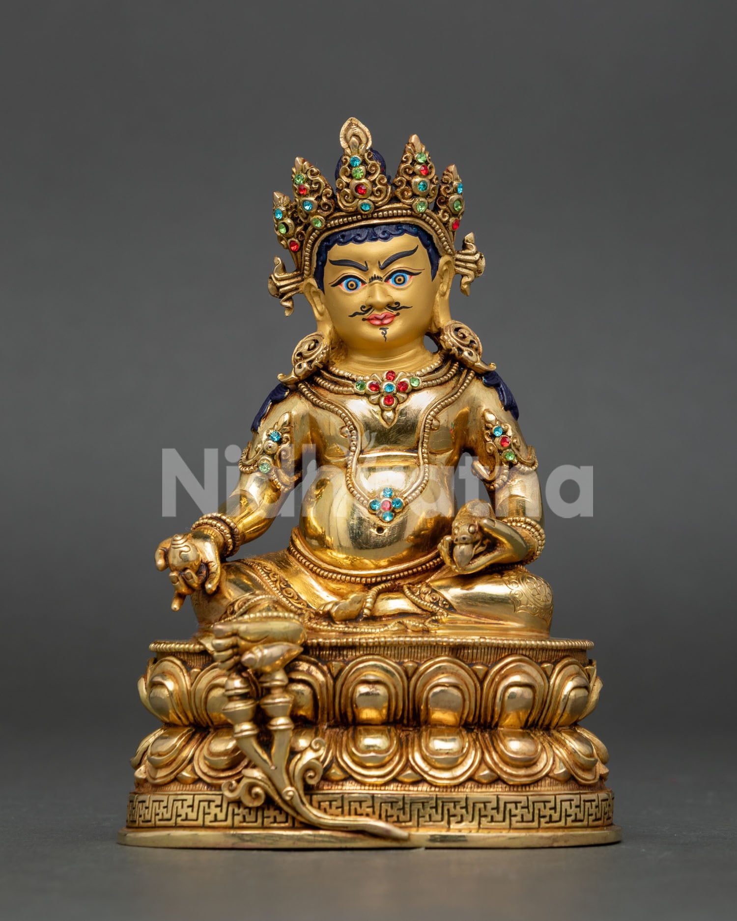 Dzambhala Statue from Nepal made of copper with 24K gold gilding and semi-precious stone decoration.