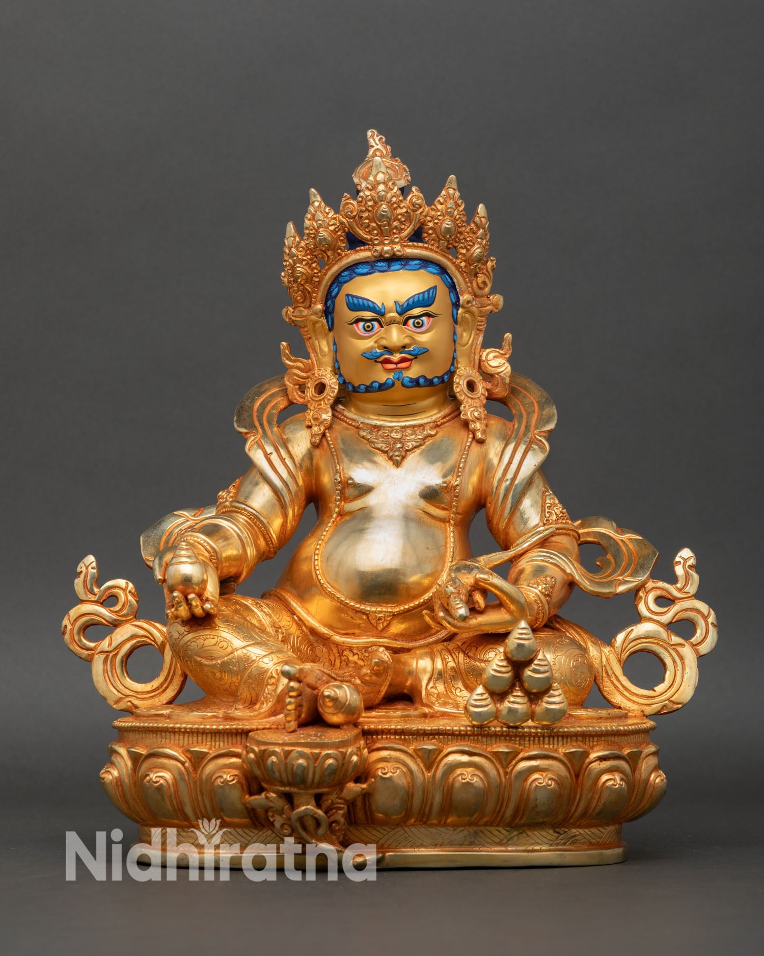 Dzambhala statue front view gold gilded copper wealth deity seated lotus pedestal Nepal Newari artisan lost wax casting