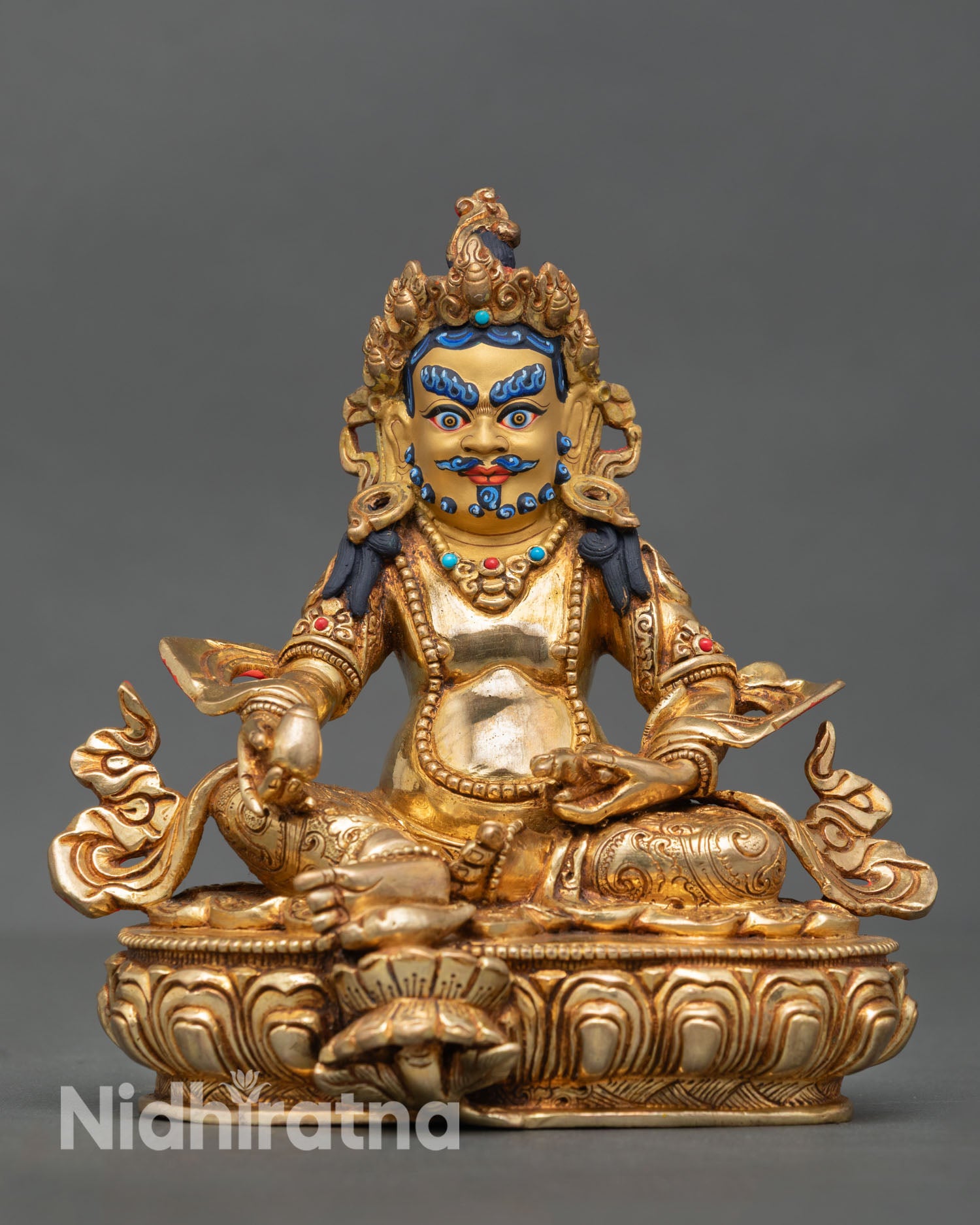 Dzambhala statue front view golden wealth deity copper gold gilded face Nepal Newari artisan lotus throne sculpture