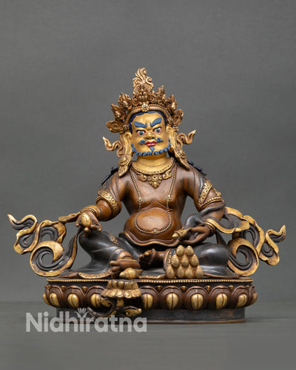 Dzambhala statue front view wealth deity copper oxidized finish gold painted face Nepal Newari artisan lotus pedestal altar sculpture