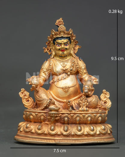 Dzambhala statue gold fire gilded copper Buddhist sculpture from Patan Nepal.
