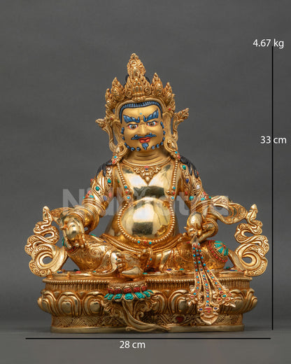 Dzambhala statue gold fire gilded copper Newari Patan Nepal.