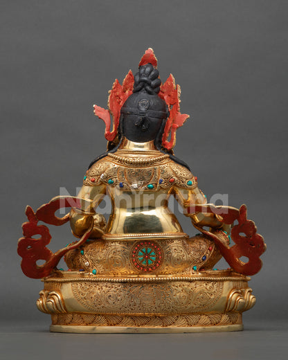 Dzambhala statue gold gilded Buddhist altar meditation shrine.