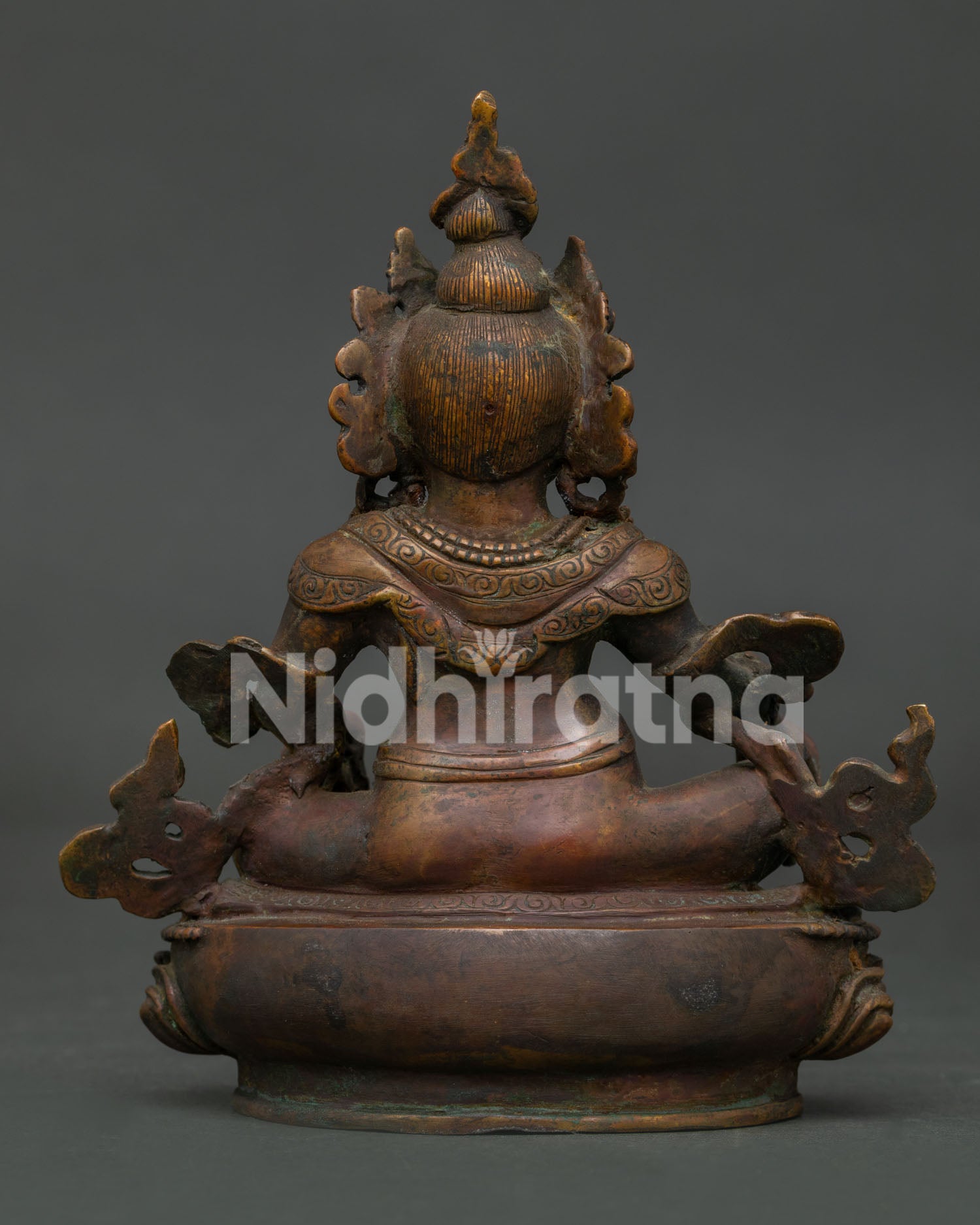 Dzambhala statue handcrafted by Newari artisans from Patan Nepal with oxidized antique copper finish.