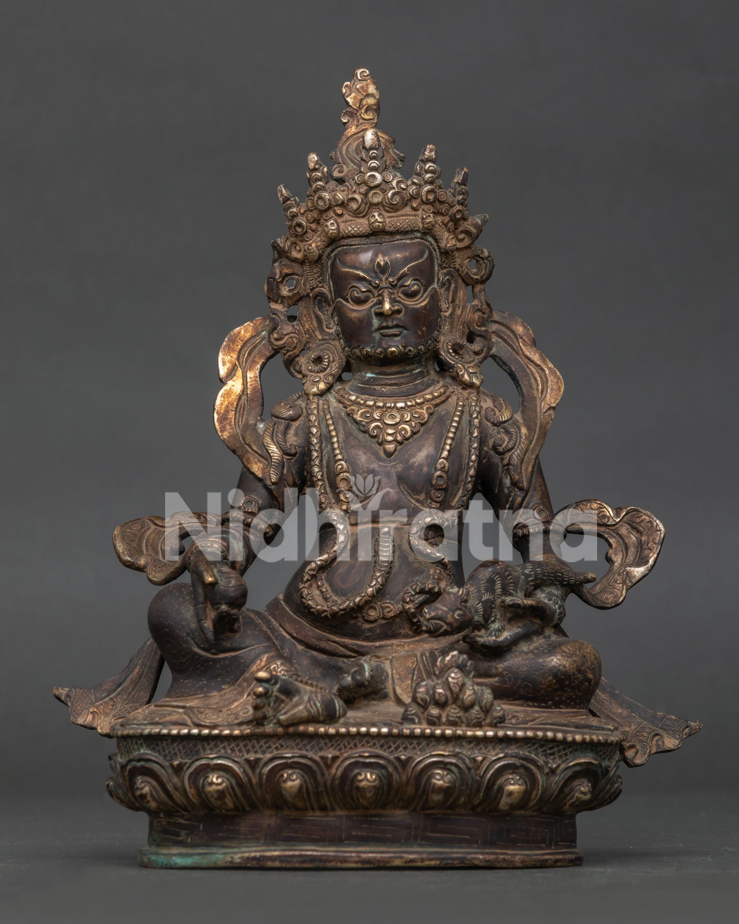 Dzambhala statue handcrafted by Newari artisans in Patan Nepal with oxidized copper finish.