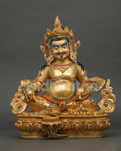 Dzambhala statue handmade in copper with 24K gold gilded finish seated on lotus pedestal 