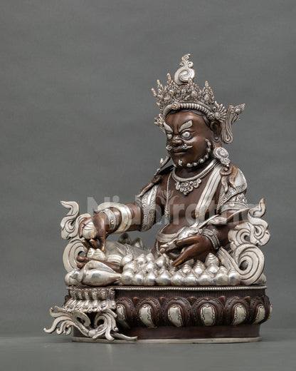 Dzambhala Statue Holding Citron Fruit and Jewel Spitting Mongoose Symbolizing Generosity