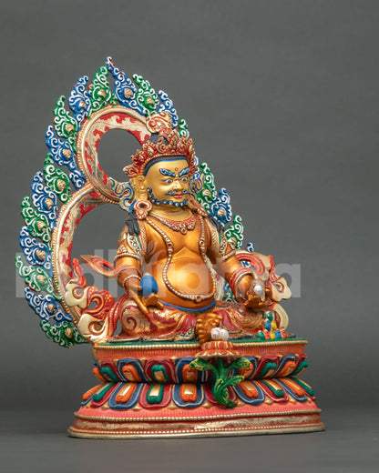 Dzambhala statue holding treasure spouting mongoose and citron fruit side view.