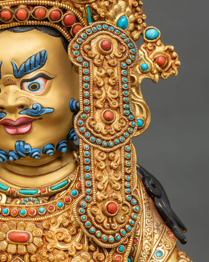 Dzambhala statue left earring close-up turquoise coral gemstone gold filigree detail