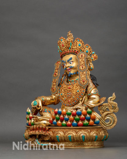 Dzambhala statue left side view mongoose jewels colorful wealth vases lotus throne