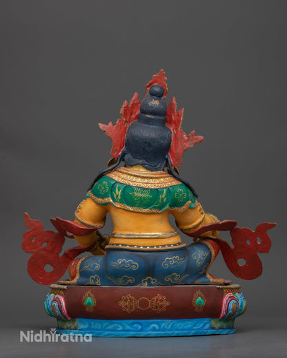 Dzambhala statue multicolor lotus pedestal silk garment citron fruit.