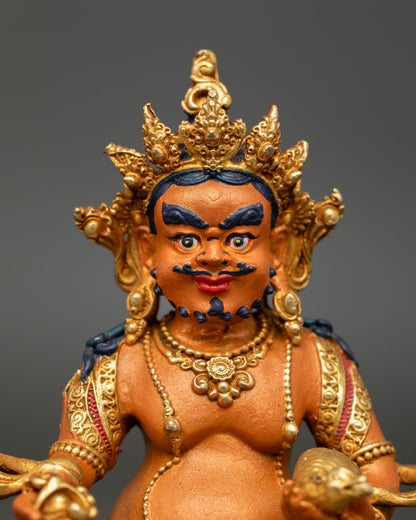 Dzambhala Statue showing intricate gold details crown ornaments and traditional Himalayan craftsmanship.