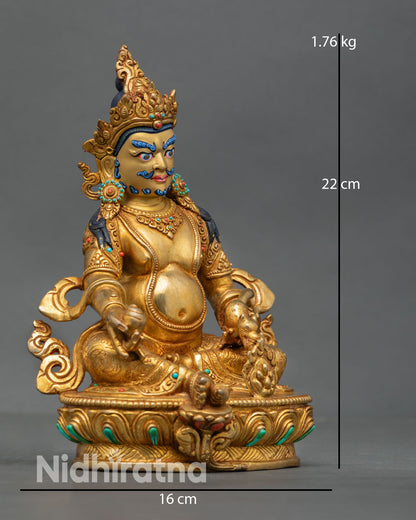 Dzambhala statue side view seated posture gold detailing flowing necklaces engraved lotus base Nepal handmade sculpture