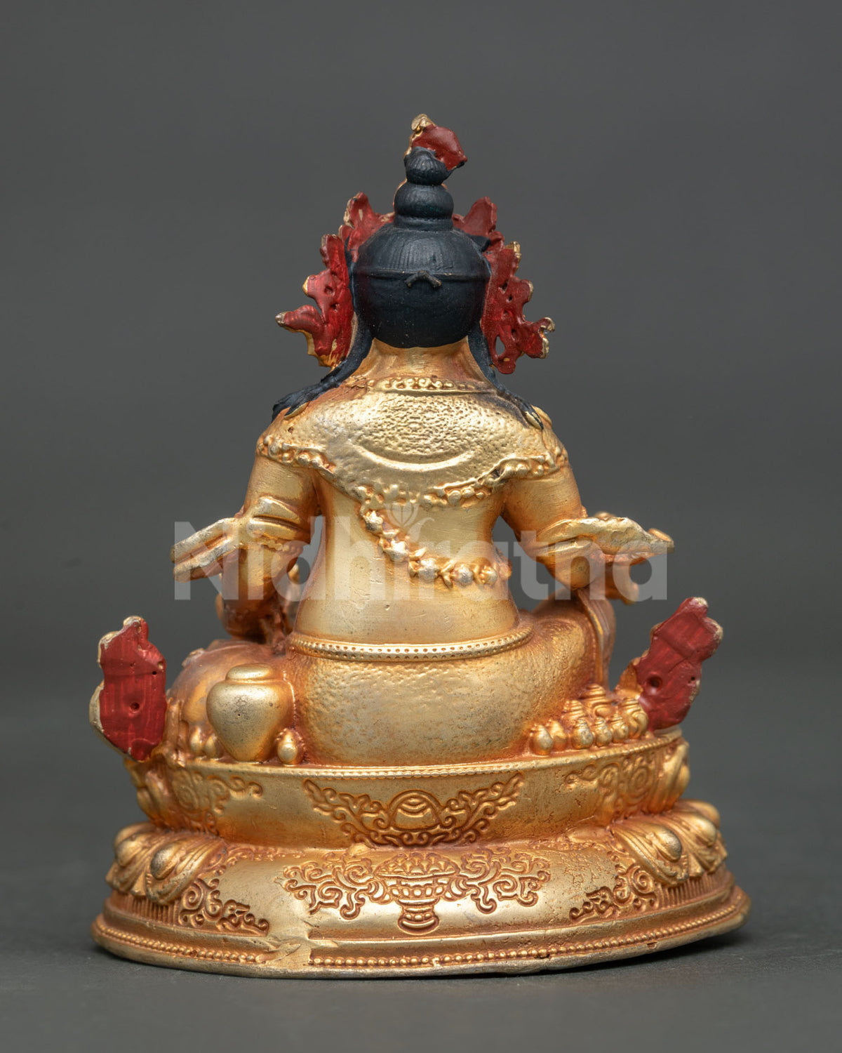 Dzambhala statue traditional Nepalese Buddhist art for altar and meditation.