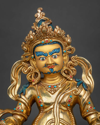Dzambhala statue with 24K gold fire gilded finish and painted face.