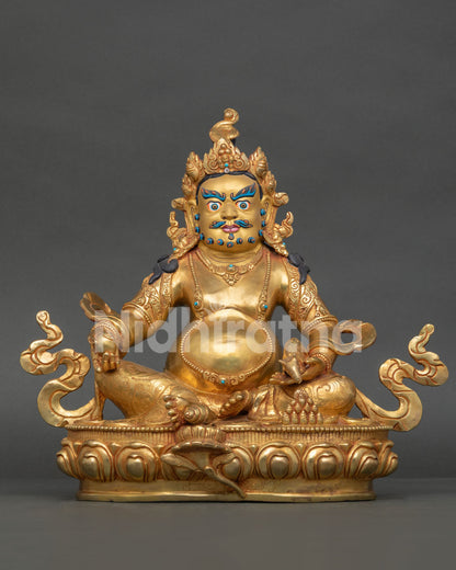 Dzambhala statue with 24K gold fire gilding, gold painted face, and semi precious stones from Nepal