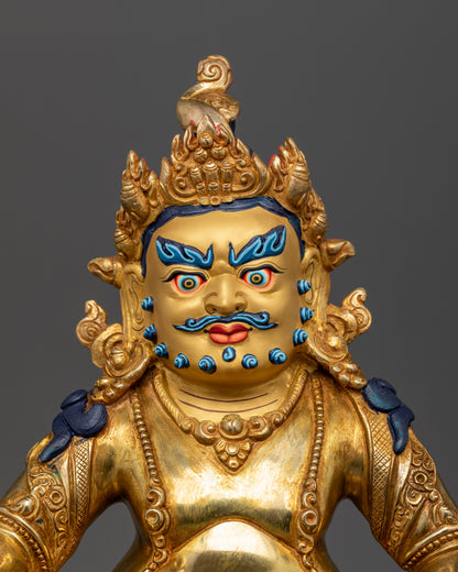 Dzambhala statue with 24K gold painted face and five jeweled crown.