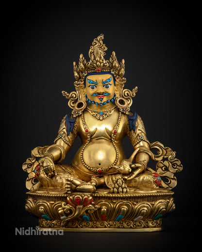 Dzambhala statue with citron fruit and jewel bestowing mongoose symbolizing prosperity