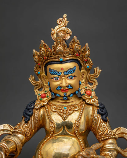Dzambhala statue with gold fire gilded finish 24k gold painted details and semi precious stones.