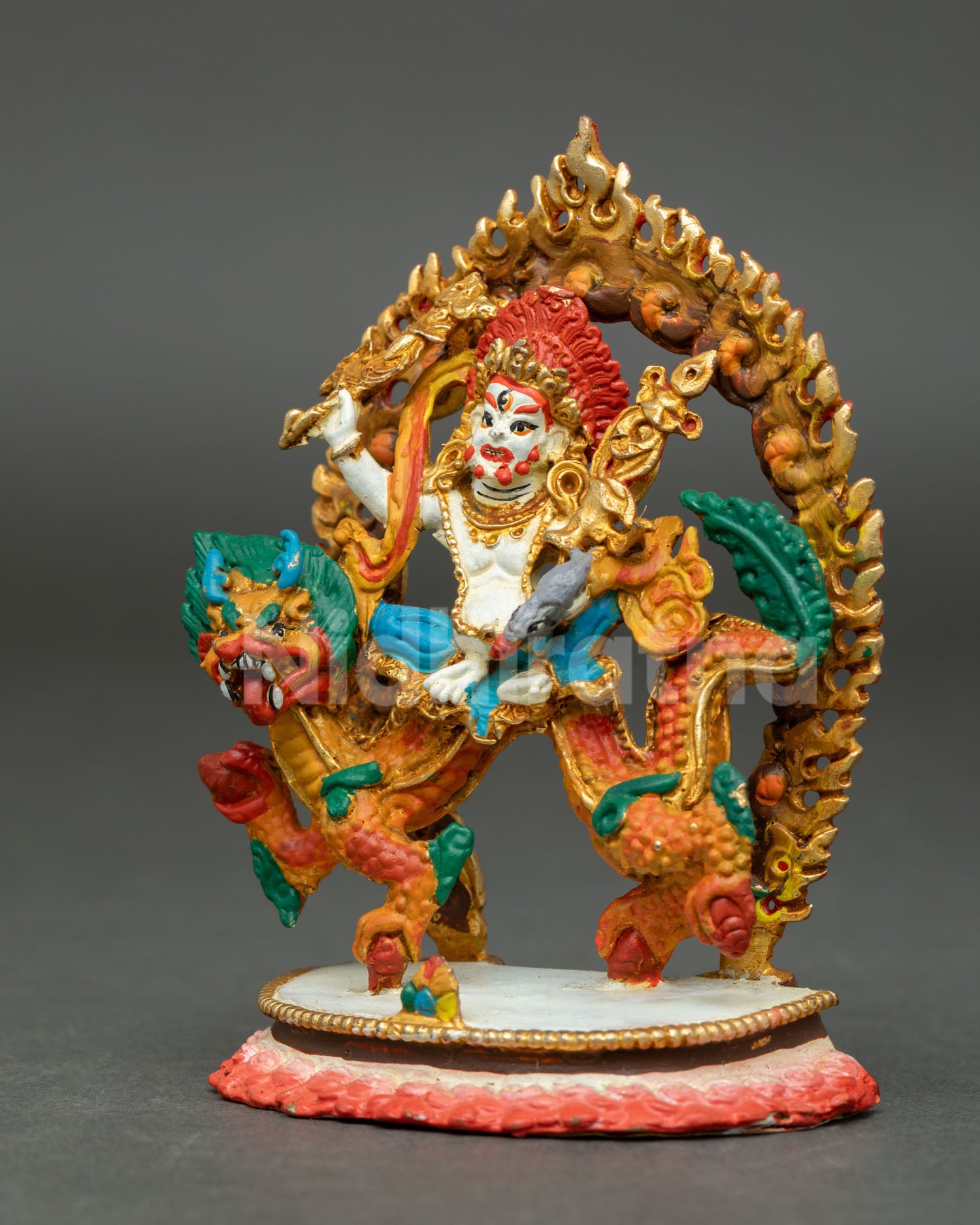 White Dzambhala wealth deity seated on Dragon Kubera lotus pedestal holding staff scepter and mongoose.