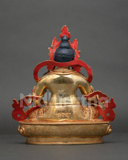 Dzambhala wealth deity statue Buddhist abundance prosperity generosity.