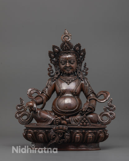 dzambhala statue front view showing oxidized copper finish and hand-carved citron fruit details