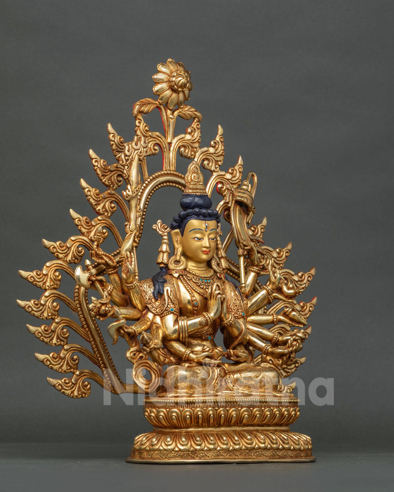 Eighteen armed Chundi Buddhist deity statue with gold painted face